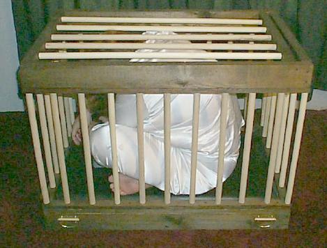 wood and leather dungeon slave cage