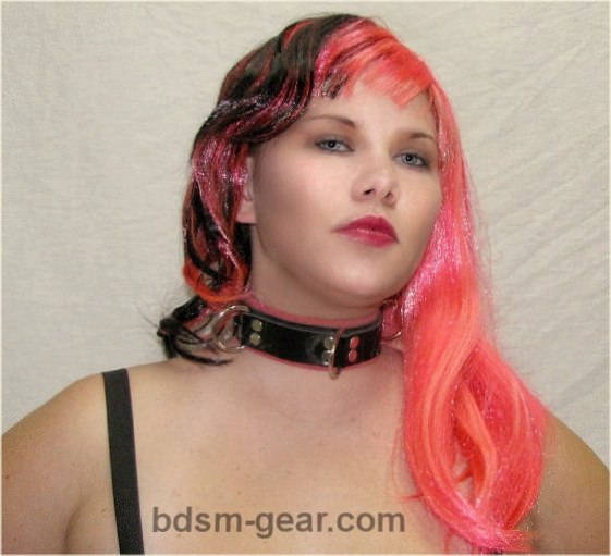 Model wearing pink suede-lined slave bondage collar with 3 D-rings